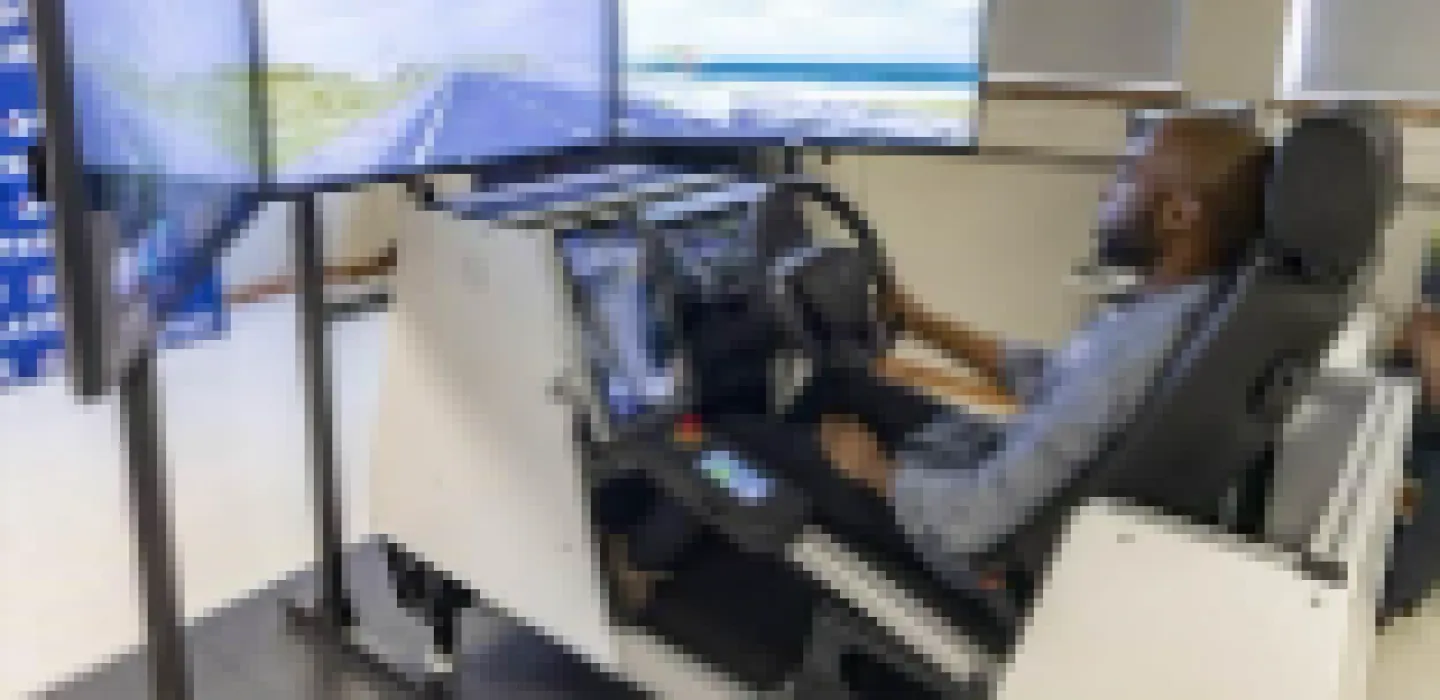 Person in front of computer screens